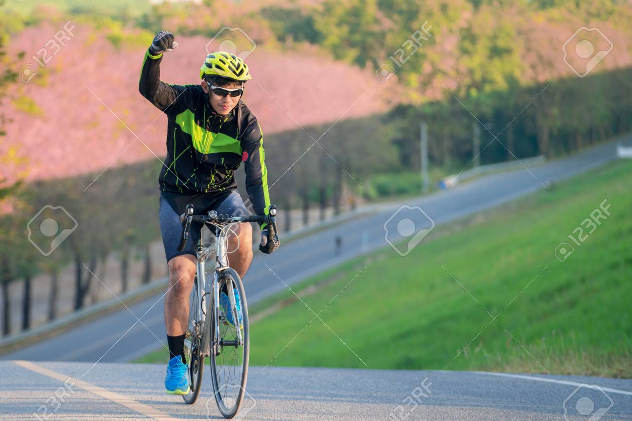Asian Man Ride A Bicycle On The Road With Nature Background And Finish This Target To Asian Man Ride A Bicycle On The Road With Nature Background And Finish This Target To