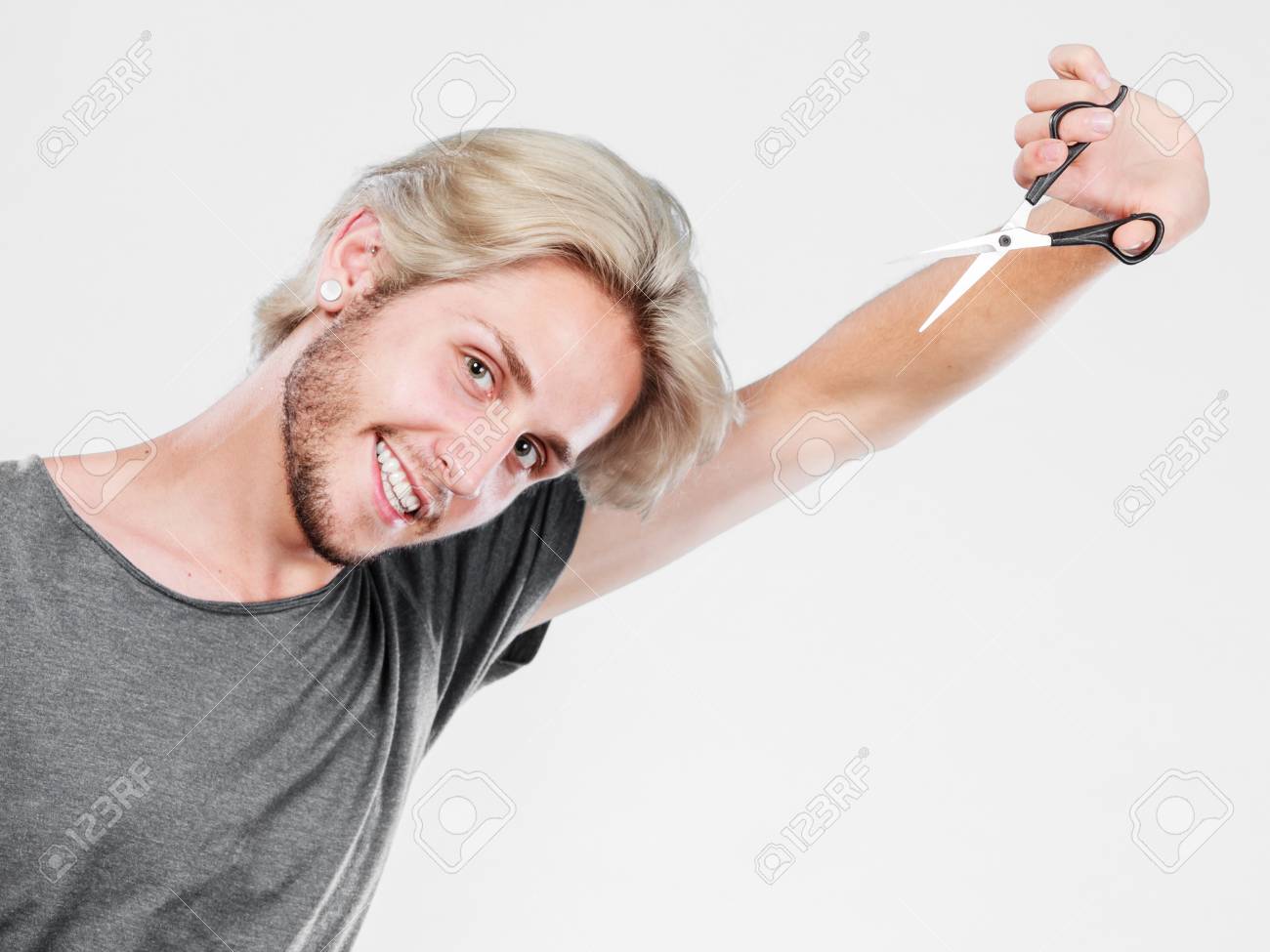 Hairstyle And Haircut Young Cool Guy Barber Holding Shears Tool