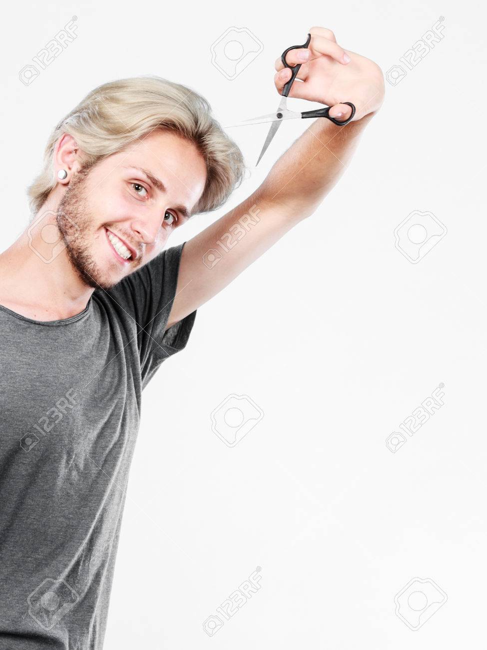 Hairstyle And Haircut Young Cool Guy Barber Holding Shears Tool