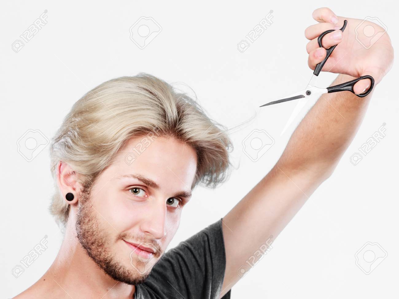 Hairstyle And Haircut Young Cool Guy Barber Holding Shears Tool