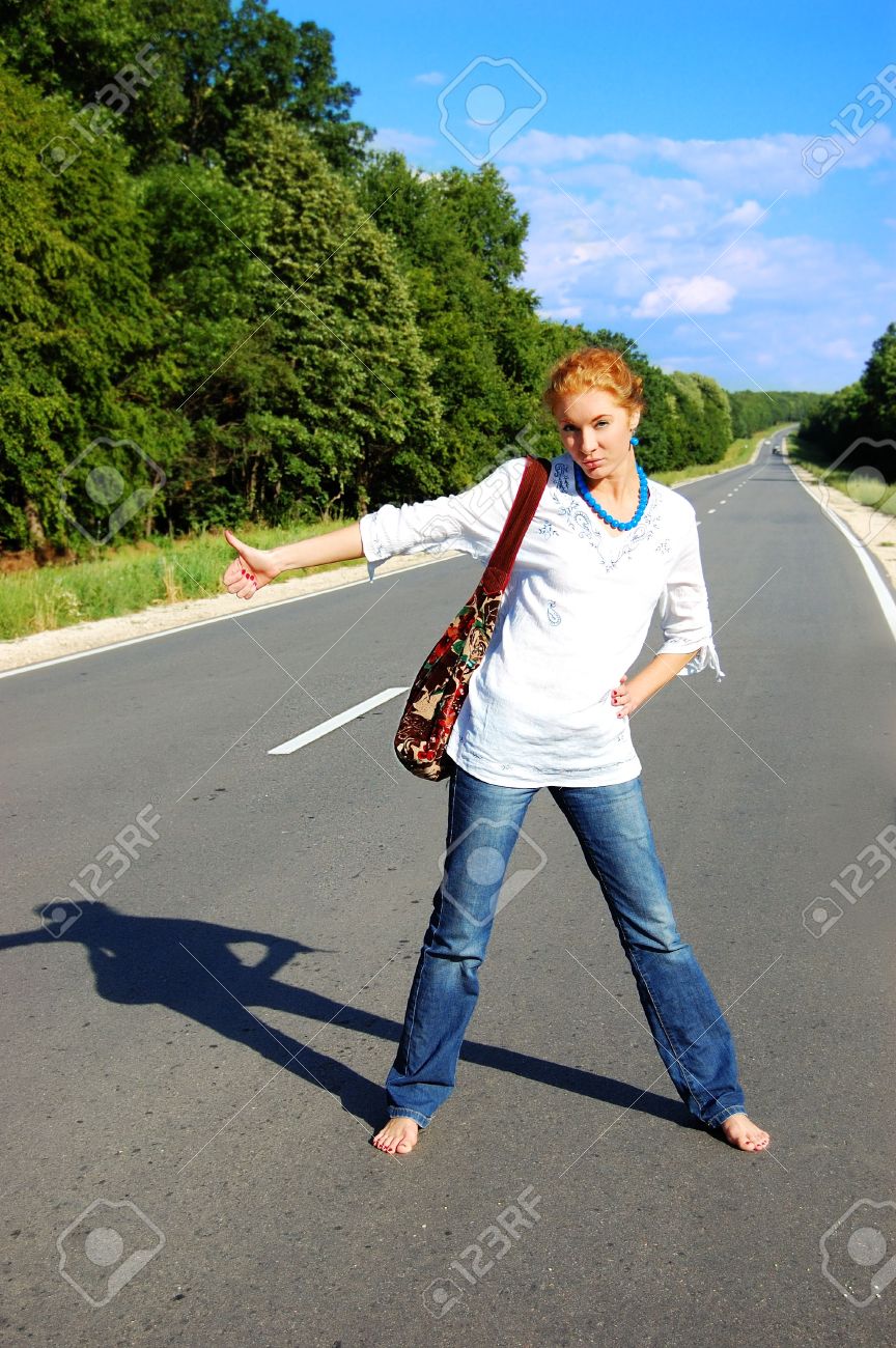 https://previews.123rf.com/images/angel_a/angel_a0808/angel_a080800079/3482631-girl-hitchhiking-on-road-under-blues-sky.jpg