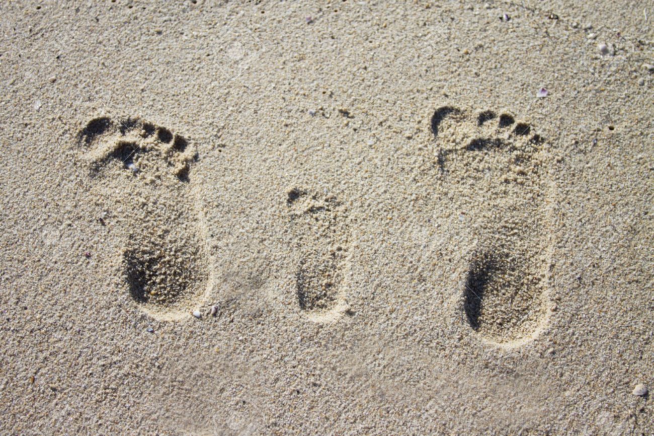 baby footprints in sand