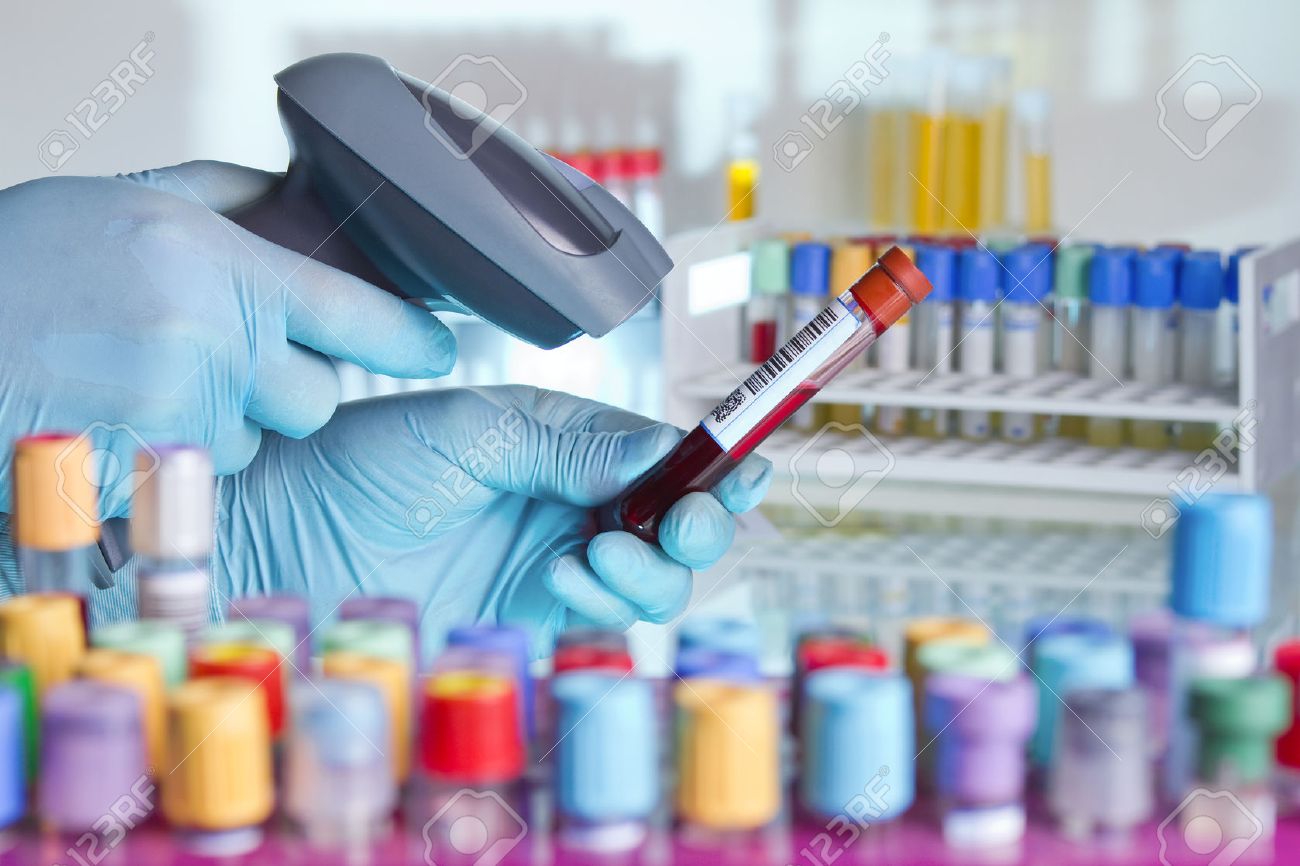 technician hands scanning barcodes on biological sample tube in the lab of blood bank / hands scanning a tube with barcode label for tracking blood sample - 38741920 technician hands scanning barcodes on biological sample tube in the lab of blood bank / hands scanning a tube with barcode label for tracking blood sample - 38741920