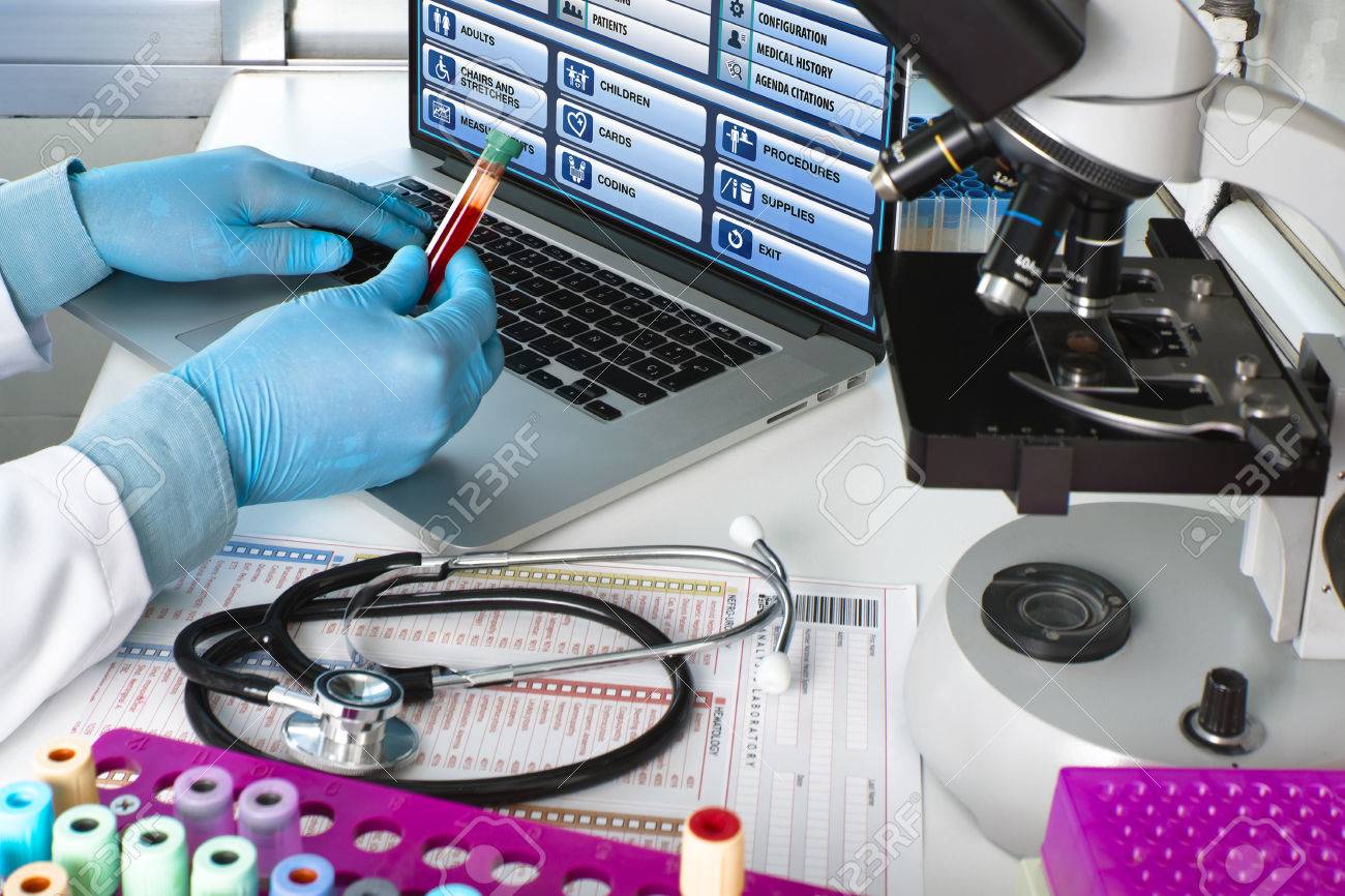 doctor testing blood tube in the laboratory / hands of a scientist holding blood tube sample in hematology lab - 60366912 doctor testing blood tube in the laboratory / hands of a scientist holding blood tube sample in hematology lab - 60366912