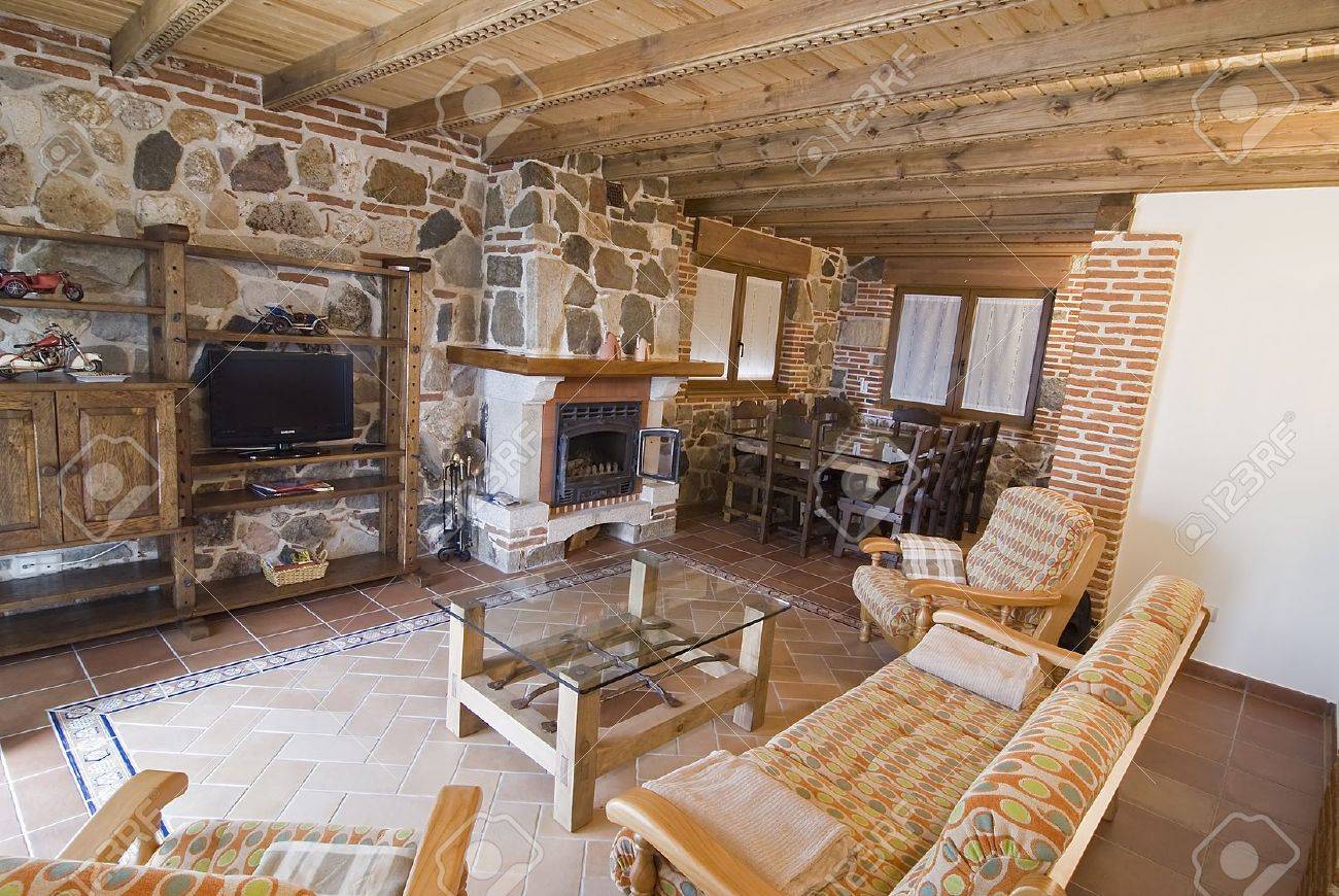 Cottage Living Room With Fireplace living room with fireplace in a country cottage. stock photo Cottage Living Room With Fireplace living room with fireplace in a country cottage. stock photo