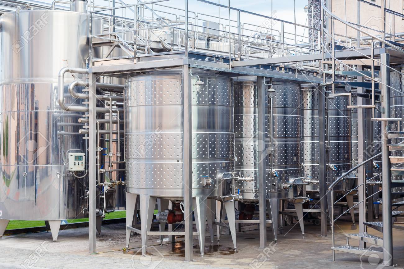 Stainless Steel Storage Tanks Or Aluminium Barrels Or Metal Vats For Wine Production Industrial Alcohol Fermentation In Vineyard Cellar Buy This Stock Photo And Explore Similar Images At Adobe Stock