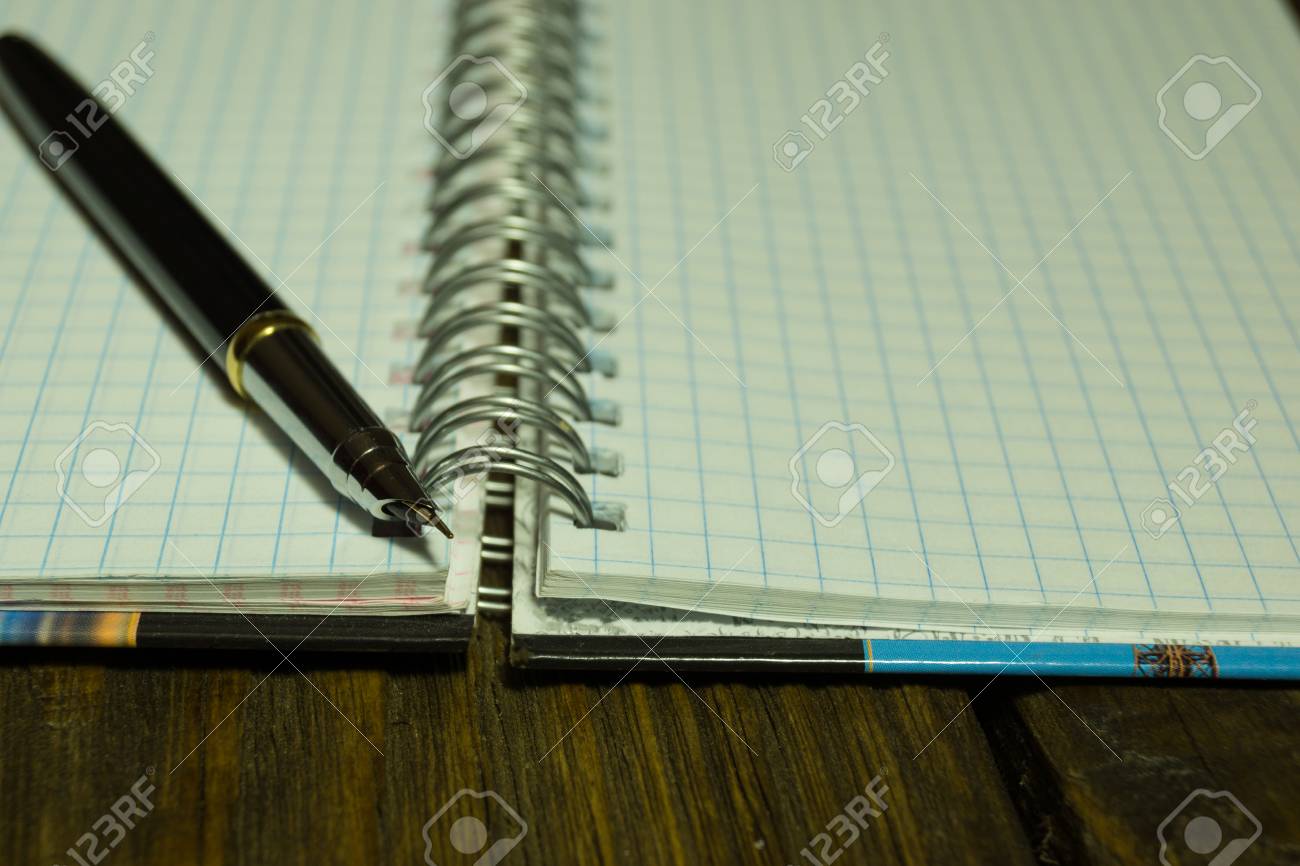 Open Blank Page Notebook And Pen On A Rustic Wooden Desk A Textured Background Copy Paste Place Stock Photo Picture And Royalty Free Image Image 87424511