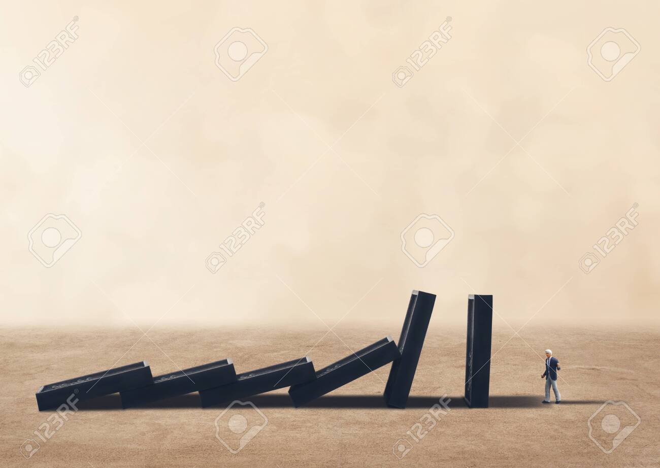 151399094-business-crisis-and-dominoes-effect-concept-row-of-dominoes-falling-on-businessman.jpg