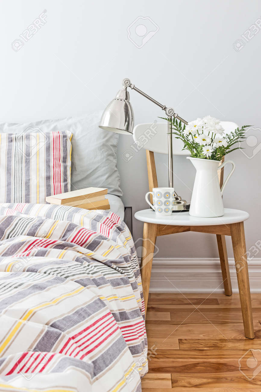 Bright and fresh bedroom decorated with a bouquet of flowers - 19915810 Bright and fresh bedroom decorated with a bouquet of flowers - 19915810