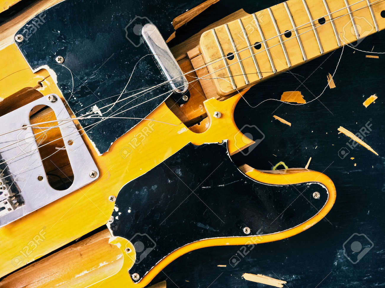 Old broken electric guitar, falling to pieces. - 51436869 Old broken electric guitar, falling to pieces. - 51436869