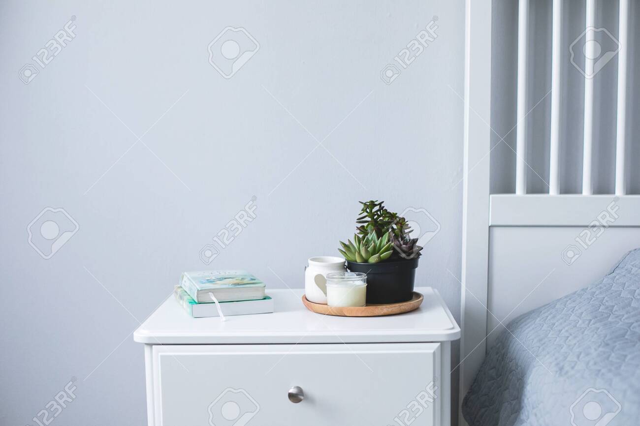 Tiny Succulents Candles And Books On Bedside Table In The Bedroom Stock Photo Picture And Royalty Free Image Image 137697791