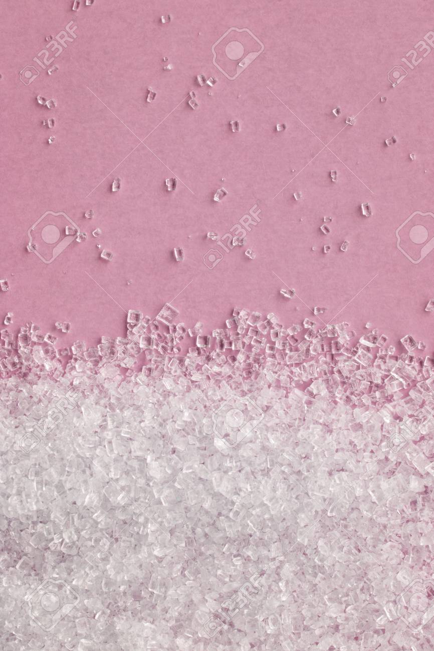 falling sugar crystals on a pink background macro ロイヤリティー