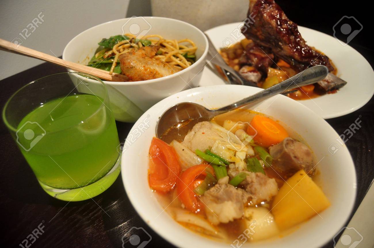 Thai People Preparing And Cooking Creative Fusion Food For Dining