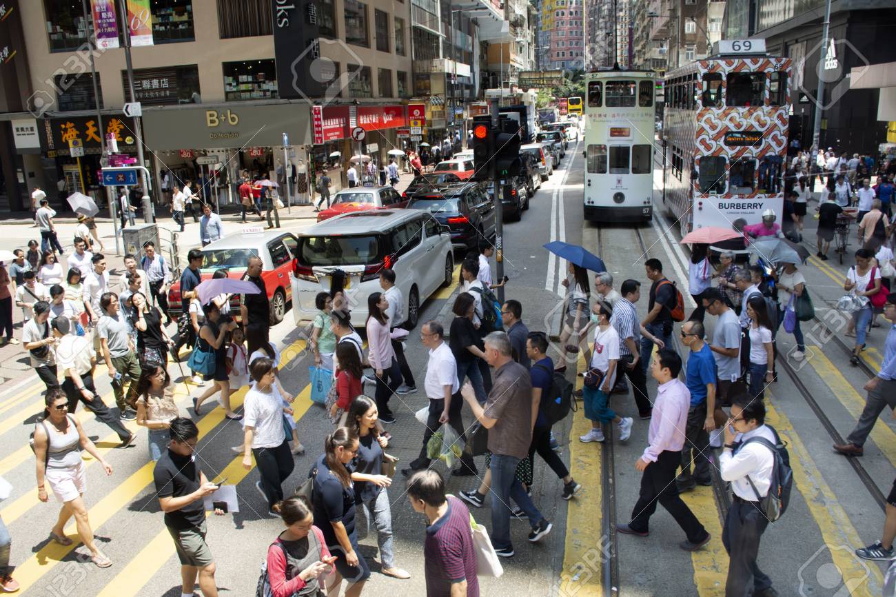 Traffic Road With Retro Tram And Chinese People Walking Crossing Road At Wan Chai Road Between Central Go To Causeway Bay On September 4, 2018 In Hong Kong, China Stock Photo, Picture