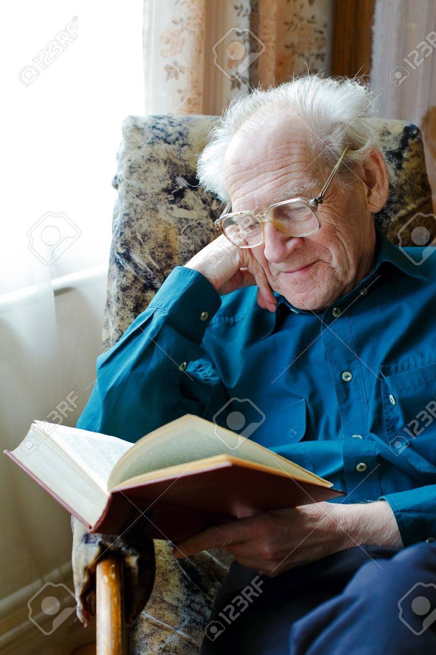 Smiling Old Man In Glasses Reading A Funny Book, Holding His Head Stock  Photo, Picture and Royalty Free Image. Image 10289624., image size:866x1300