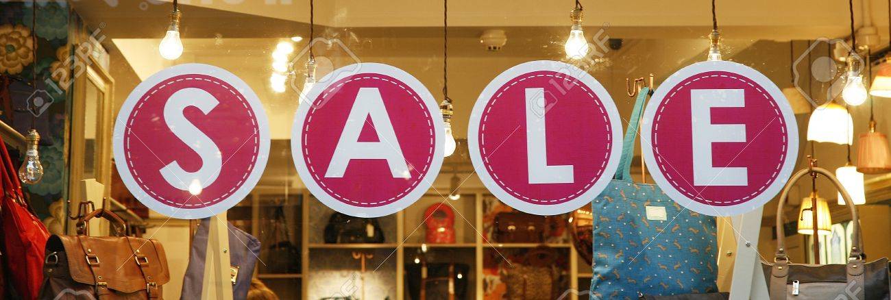 sale signs in shop window big reductions stock photo picture and window sale sign