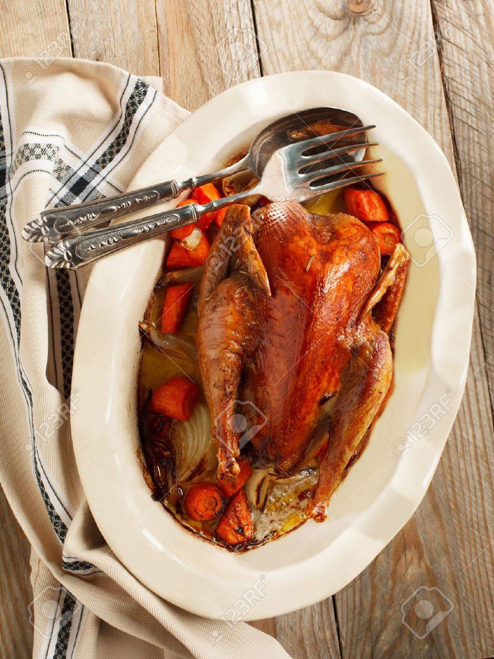 Baked pheasant in red wine with carrot and onion - 19295925 Baked pheasant in red wine with carrot and onion - 19295925