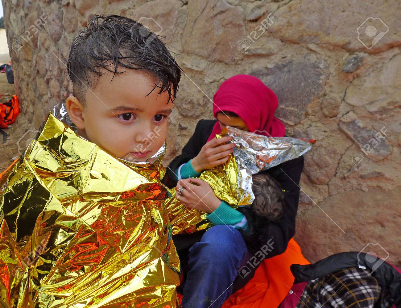 Lesvos, Greece- October 20, 2015. Refugee migrants, arrived on Lesvos in inflatable dinghy boats, they stay in refugee camps waiting for the ferry to mainland Greece continuing their journeys through Europe to seek asylum. - 73070541 Lesvos, Greece- October 20, 2015. Refugee migrants, arrived on Lesvos in inflatable dinghy boats, they stay in refugee camps waiting for the ferry to mainland Greece continuing their journeys through Europe to seek asylum. - 73070541