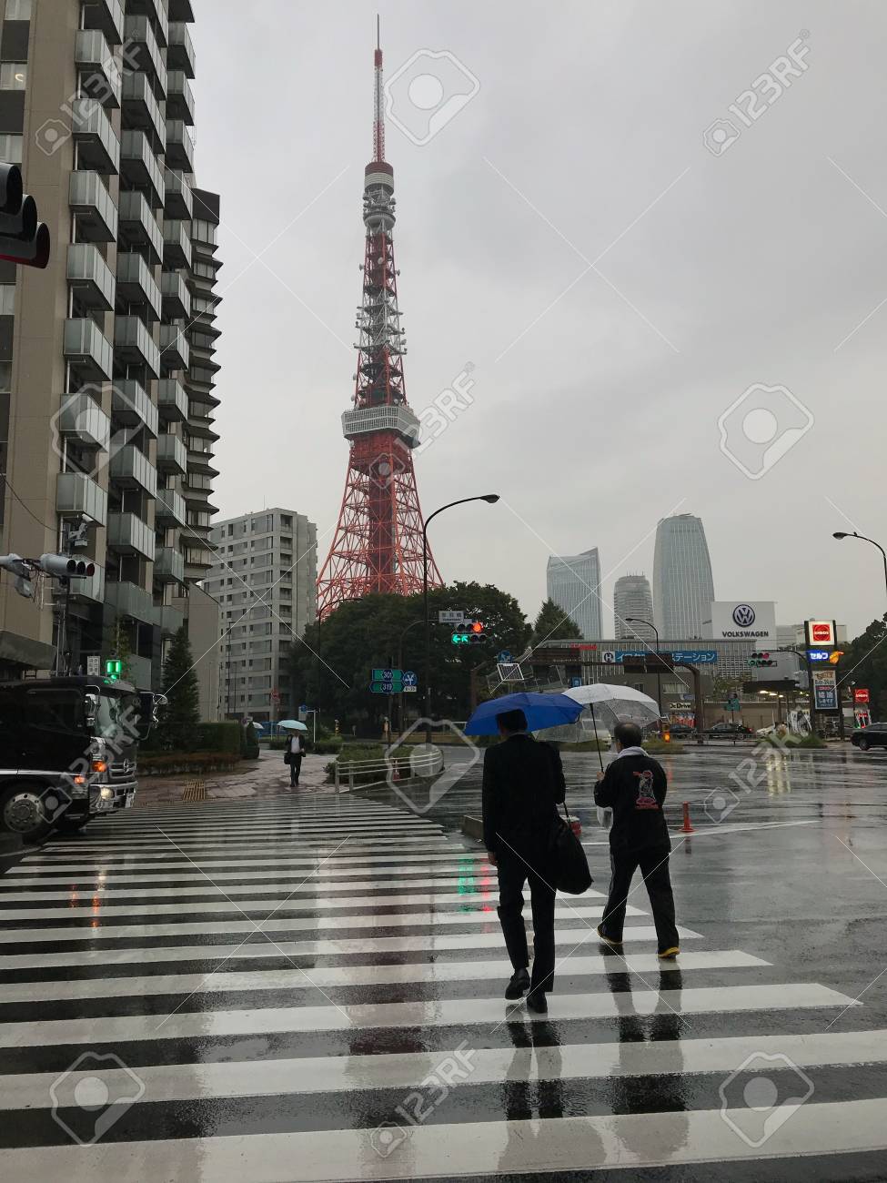 Walking In The Rain To Tokyo Tower Stock Photo Picture And