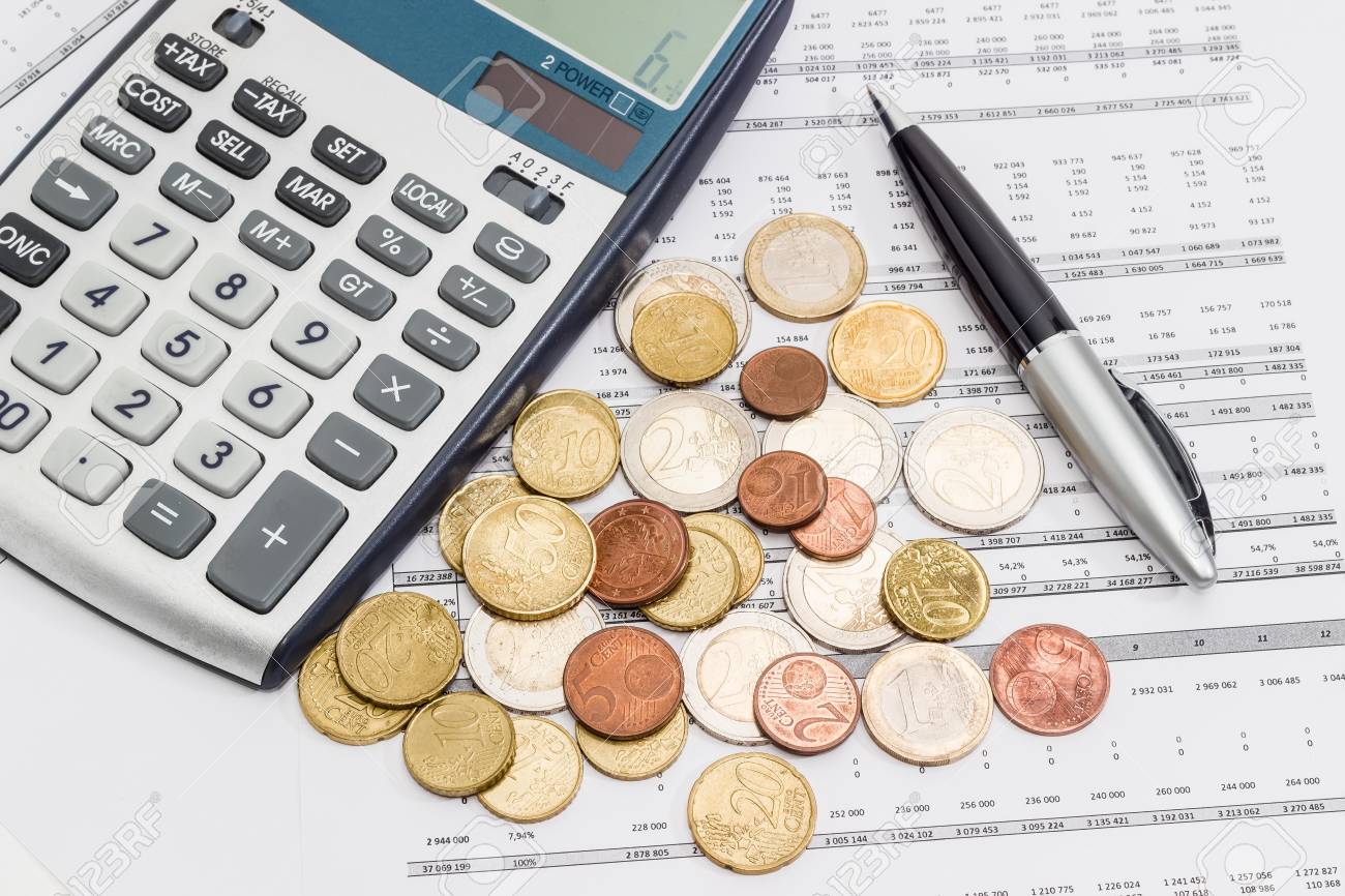 Several Euro Coins From 1 Cents To 2 Eurotered On The Printed Table With Data Several Euro Coins From 1 Cents To 2 Eurotered On The Printed Table With Data
