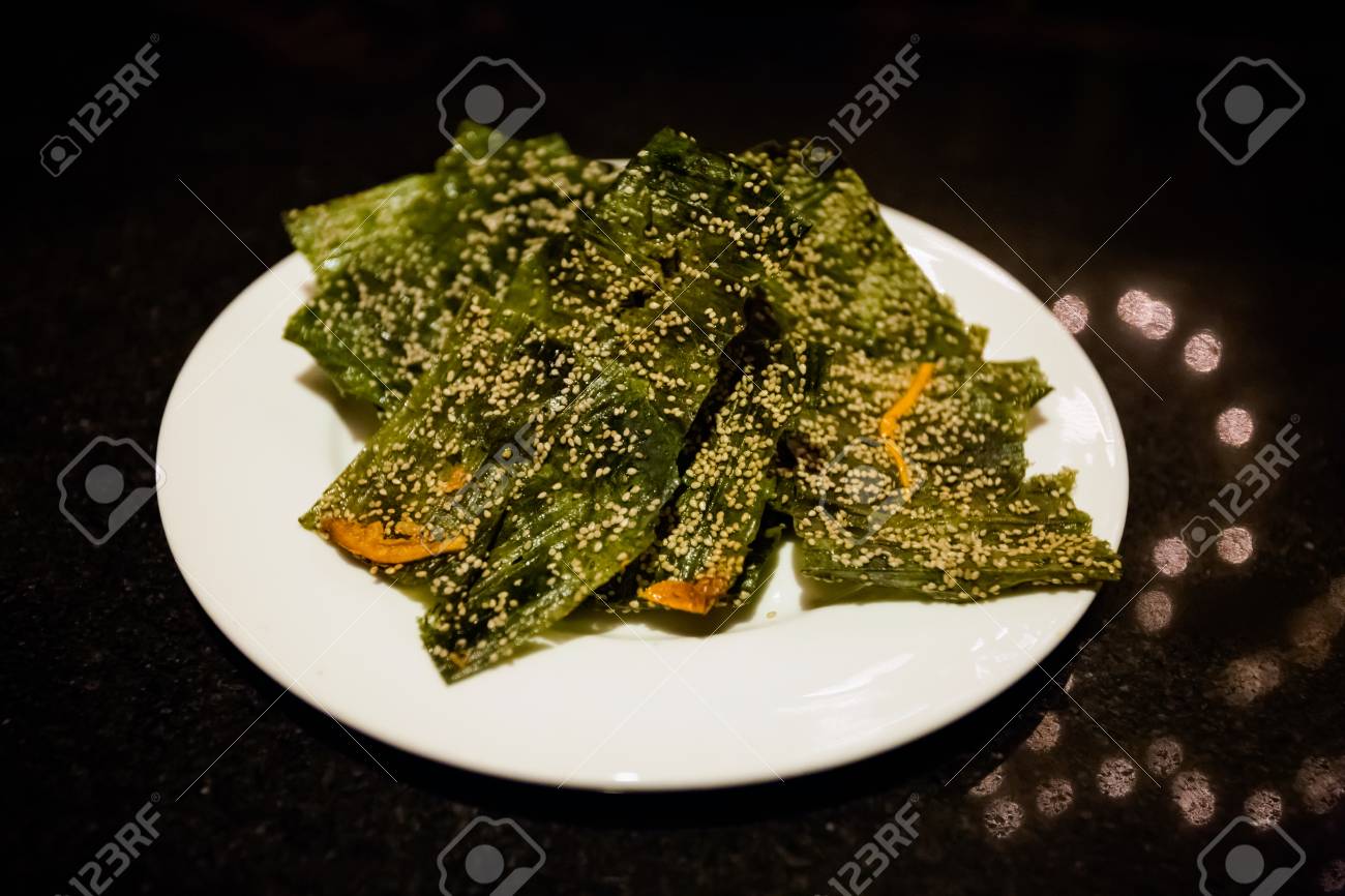 stacks of fresh asian sundried khaipen algae seaweed sheets with algae sheets
