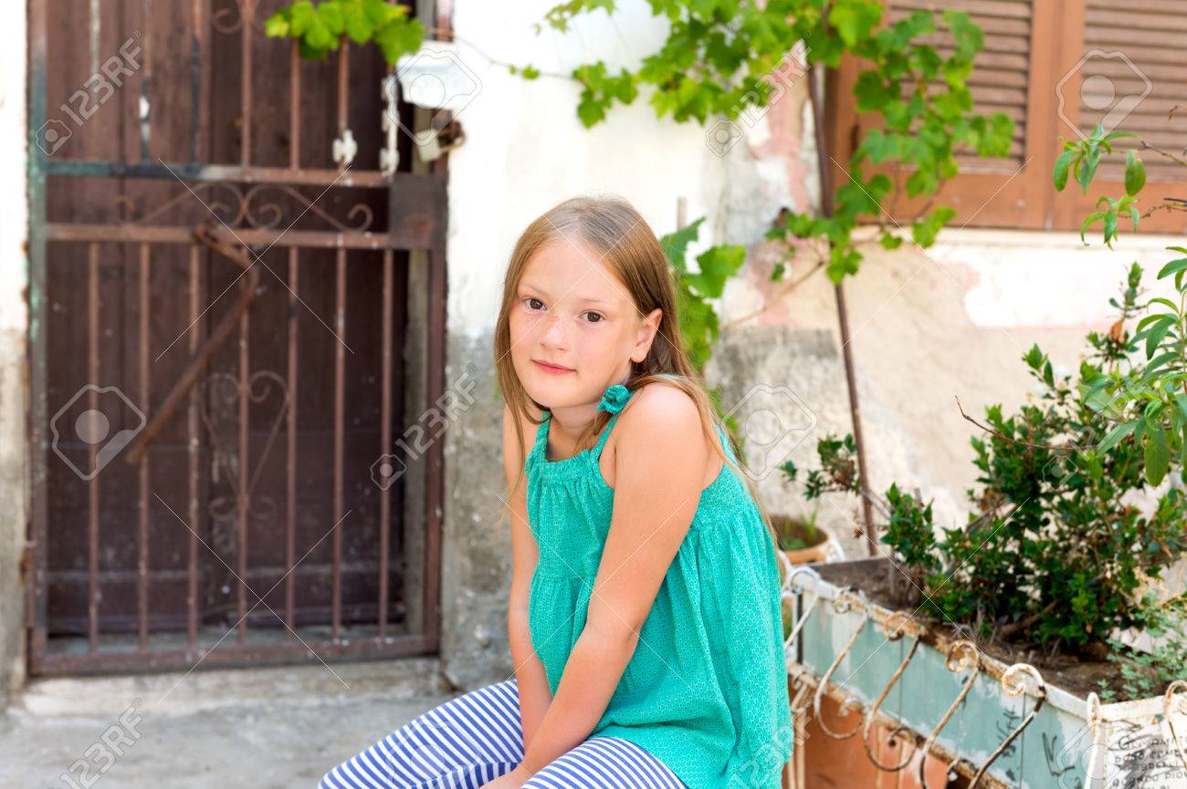 Portrait Of A Cute Little Girl Resting In A Typical Old Italian Town Stock Photo Picture And Royalty Free Image Image