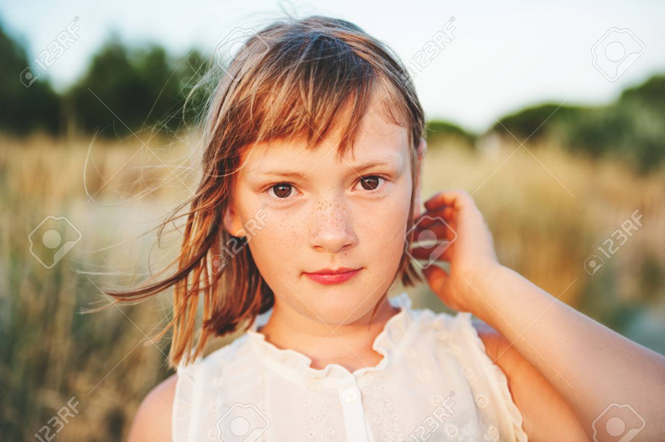 Close Up Portrait Of Sweet Little Girl With Short Bob Haircut