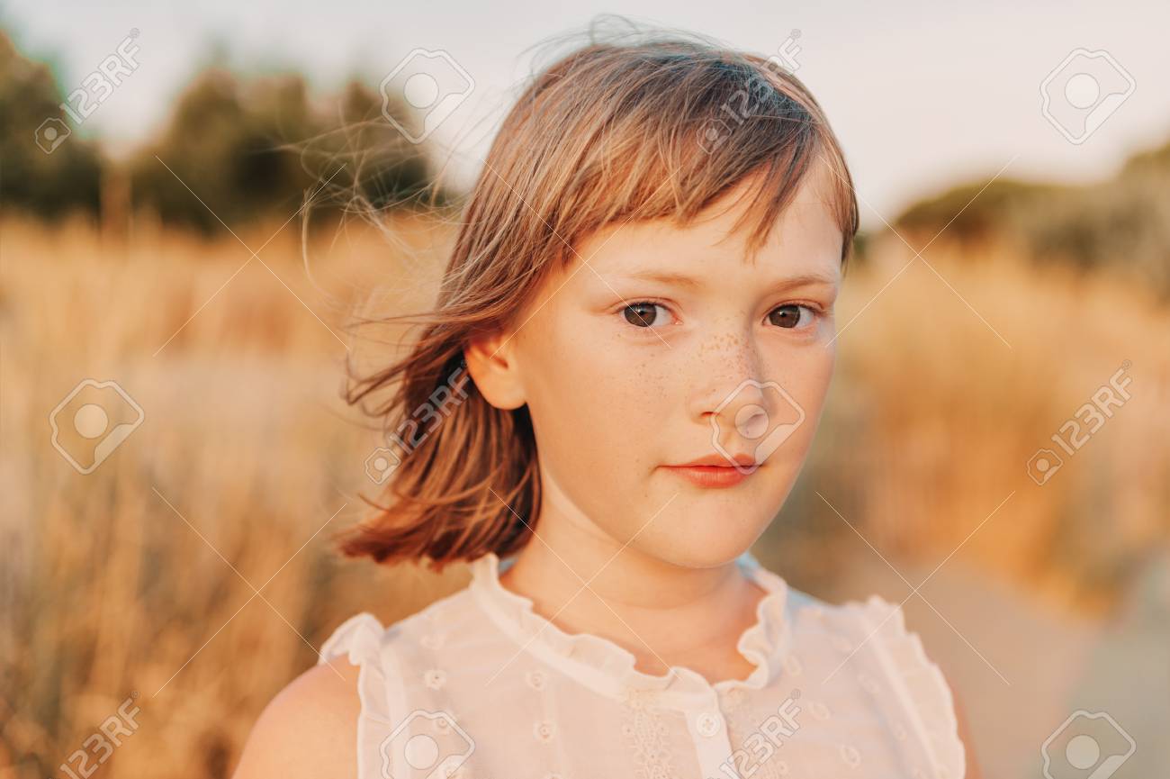 Close Up Portrait Of Sweet Little Girl With Short Bob Haircut