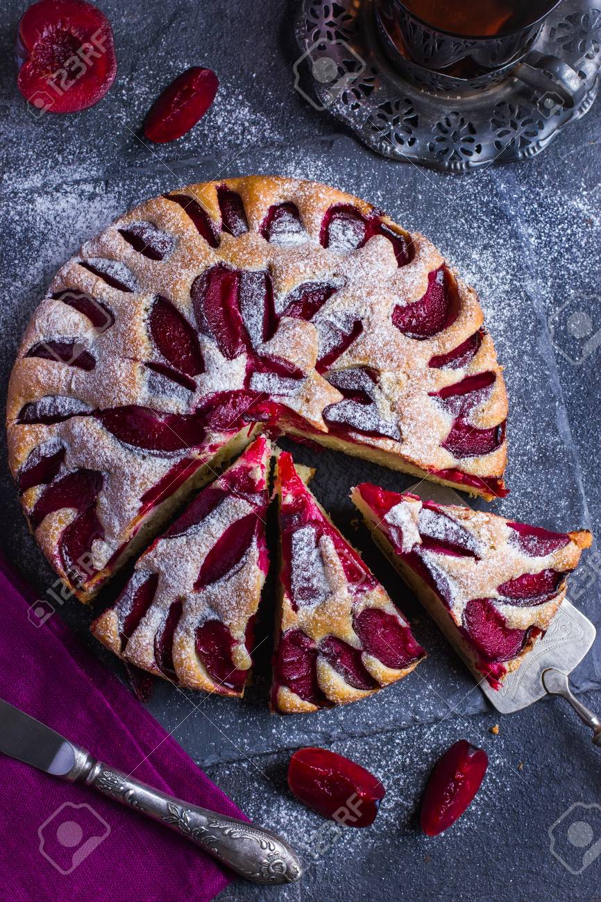 Rustic Plum Cake On Dark Background Top View Stock Photo Rustic Plum Cake On Dark Background Top View Stock Photo