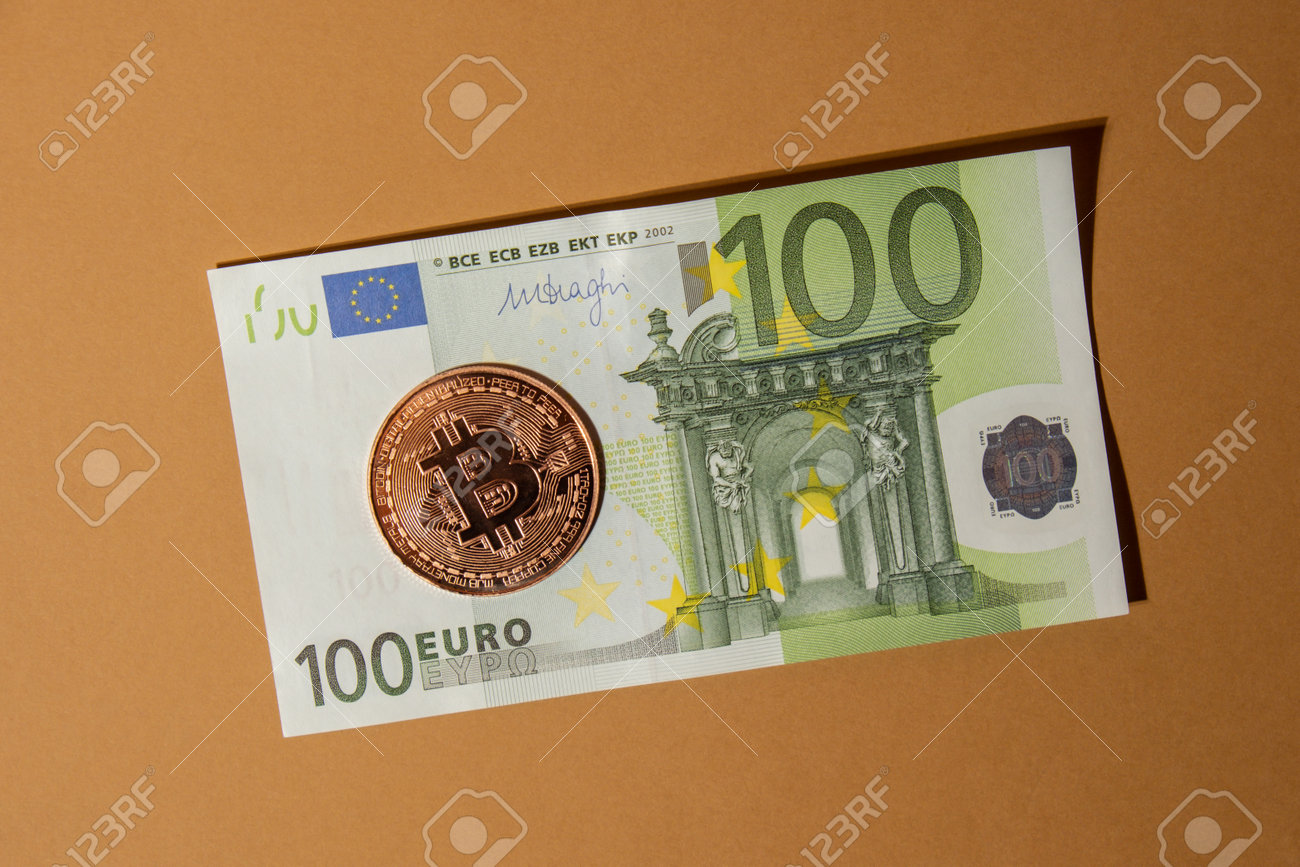 Bitcoin Gold Coin On Bills Of 100 Euros Eu Currency. Bitcoin Mining Trading  Concept. BTC Golden Money Spinning Around. Worldwide Virtual Internet  Cryptocurrency Or Crypto Digital Payment System Stock Photo, Picture and