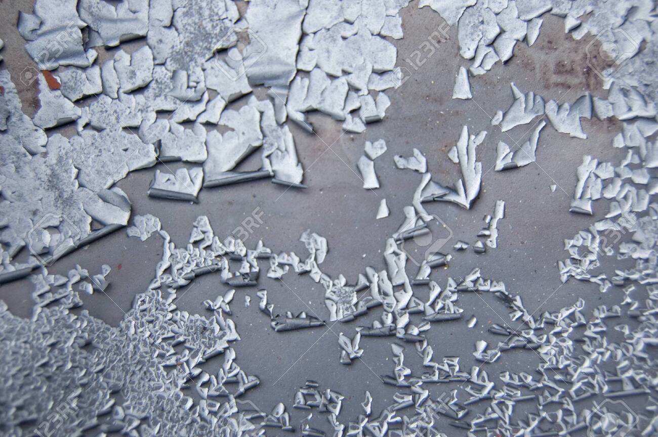 Old cracked paint pattern on rusty background. Peeling grunge material. Damaged metal surface. Scratched plate - 133111176 Old cracked paint pattern on rusty background. Peeling grunge material. Damaged metal surface. Scratched plate - 133111176