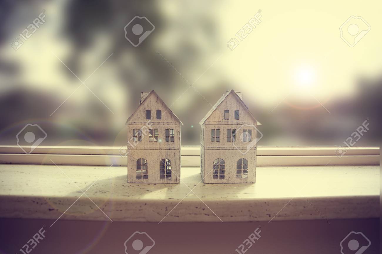 Modern Window Sill Closeup With Two Little White Houses