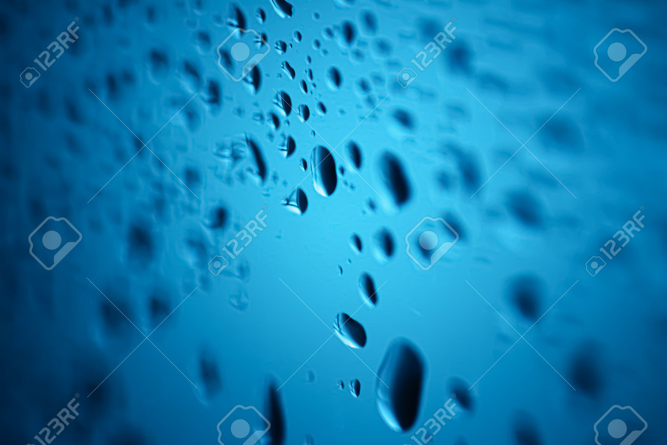Liquid water drops on glass surface, abstract backdrop and science background - 165816644 Liquid water drops on glass surface, abstract backdrop and science background - 165816644