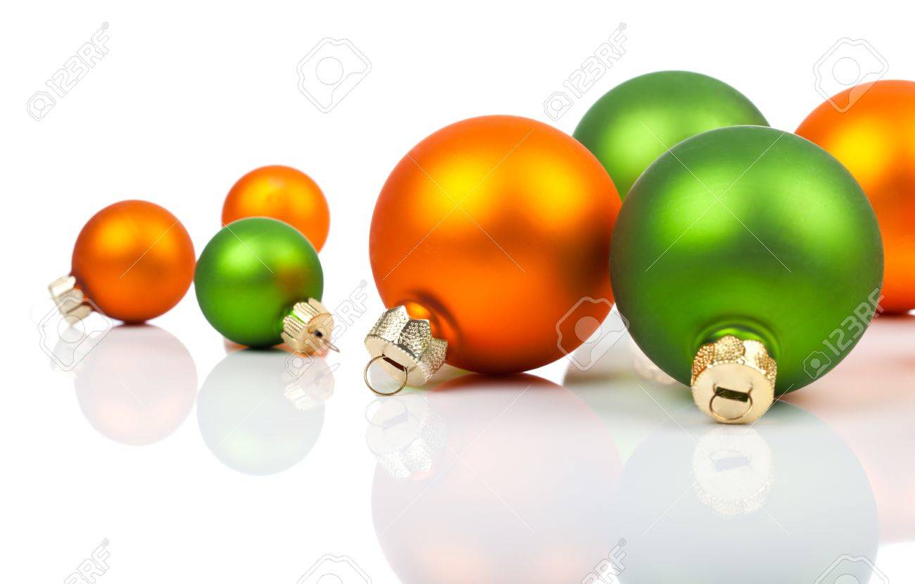 Multi Colored Christmas Ornaments Orange And Green On A White Background With Copy Multi Colored Christmas Ornaments Orange And Green On A White Background With Copy