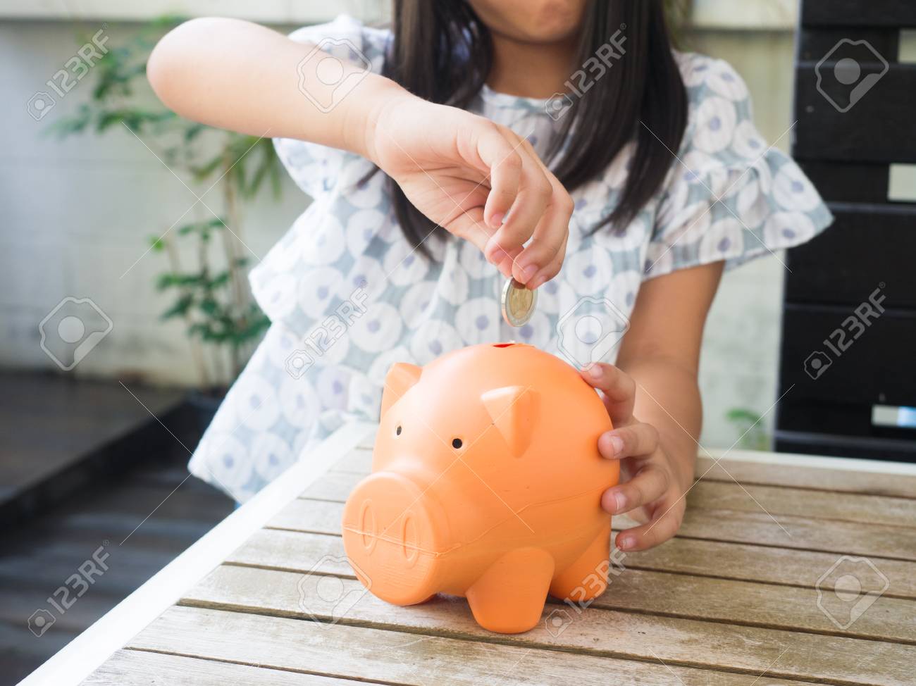 little girl piggy bank