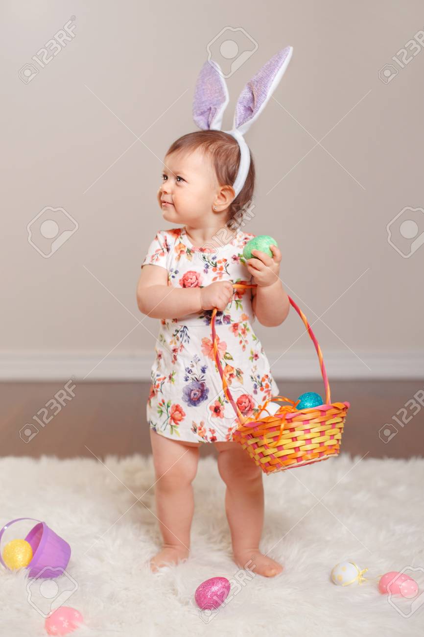 baby holding basket