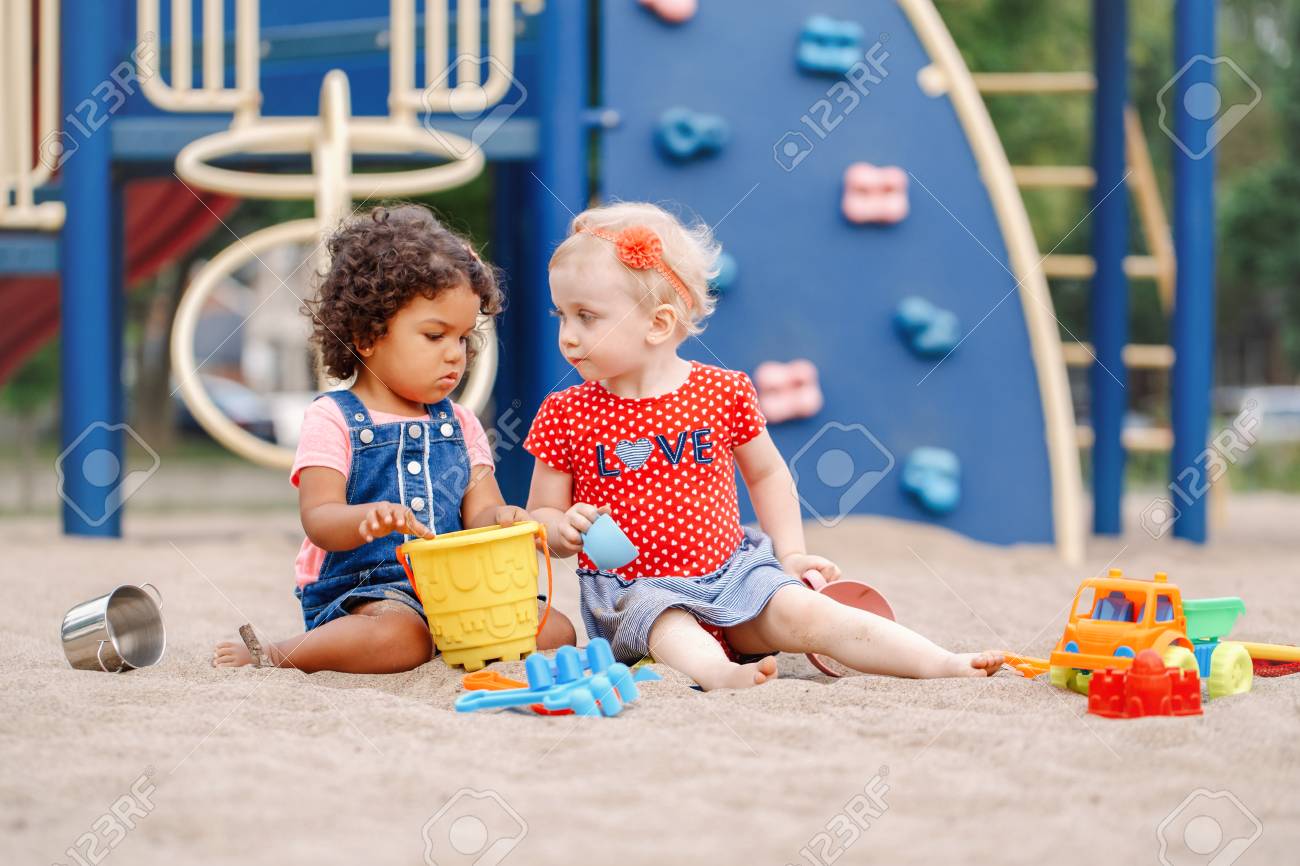 little girls playing with babies