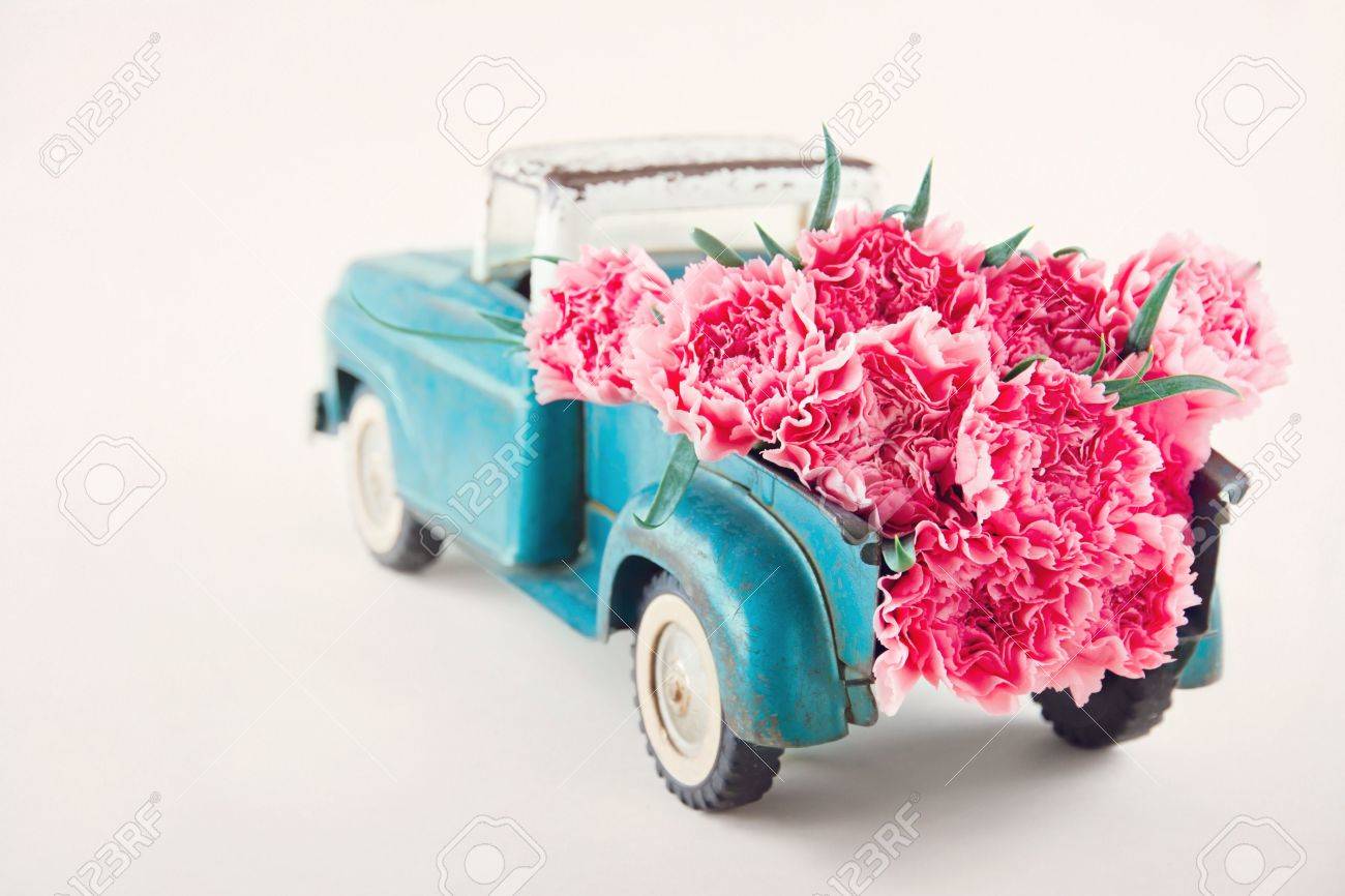 Old Antique Toy Truck Carrying Pink Carnation Flowers Stock Photo, Picture  And Royalty Free Image. Image 20911174.