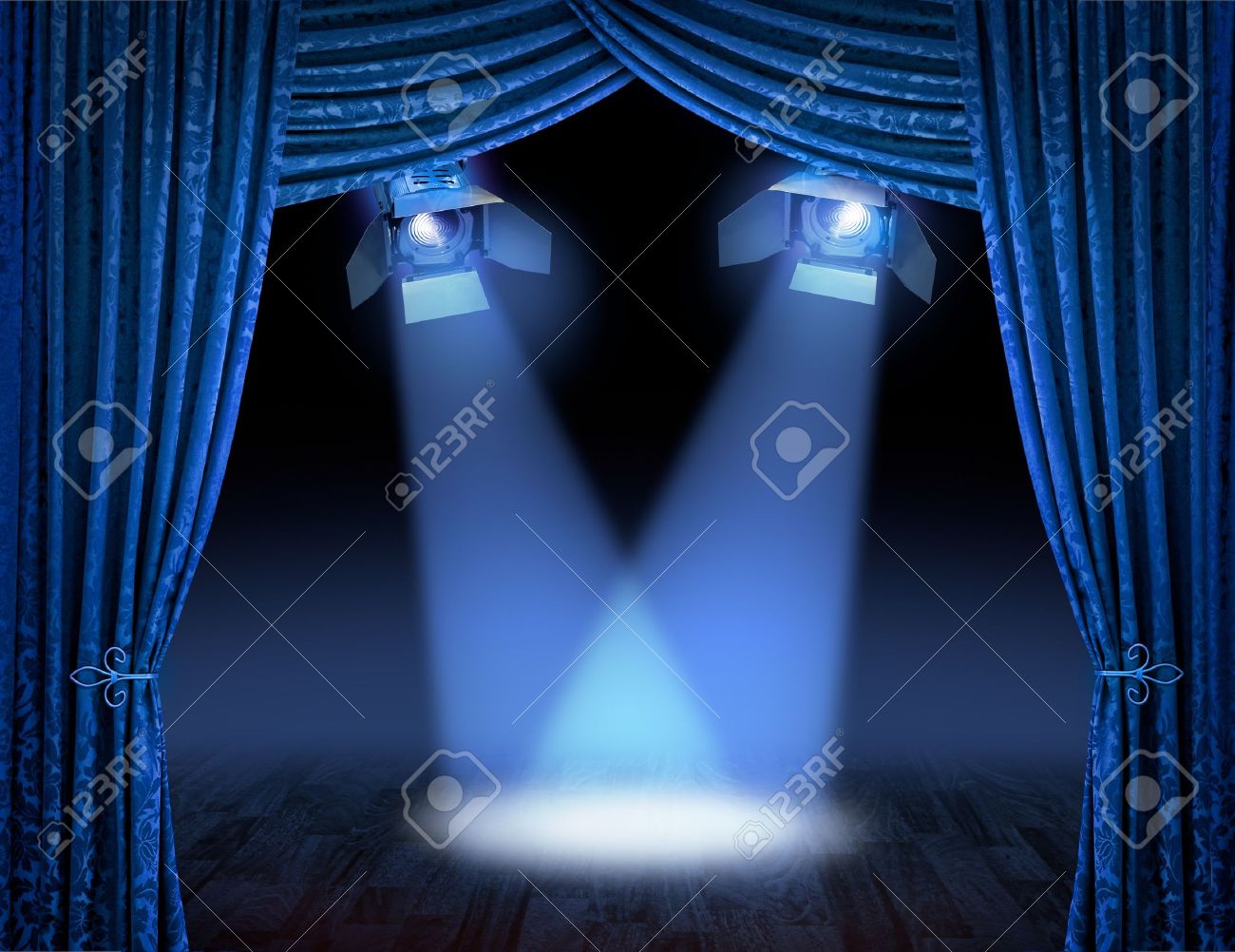 Blue Theater Stage Curtains With Spotlights Beams Stock Photo