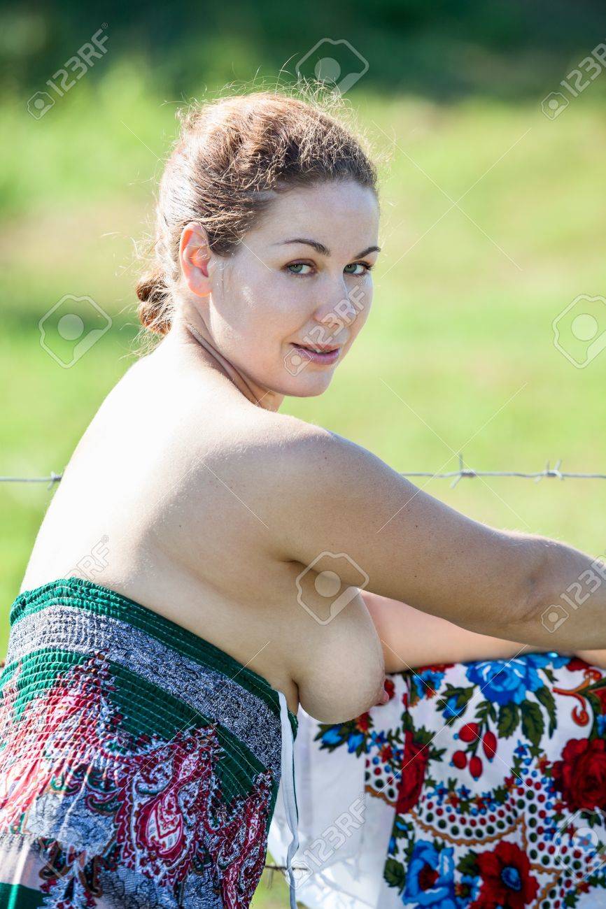 Beauty Woman With Naked Breast Standing Near Fence In Countryside Stock  Photo, Picture and Royalty Free Image. Image 21461303.
