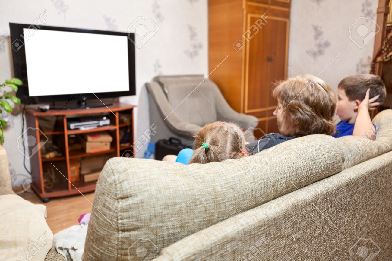 Living Room With Tv And People family at home, watching lcd tv sitting on sofa, three people Living Room With Tv And People family at home, watching lcd tv sitting on sofa, three people