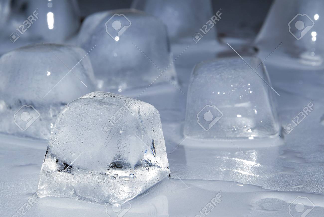 Melting Ice Cubes On A Table Stock Photo, Picture and Royalty Free Image.  Image 102123814., image size:1300x873