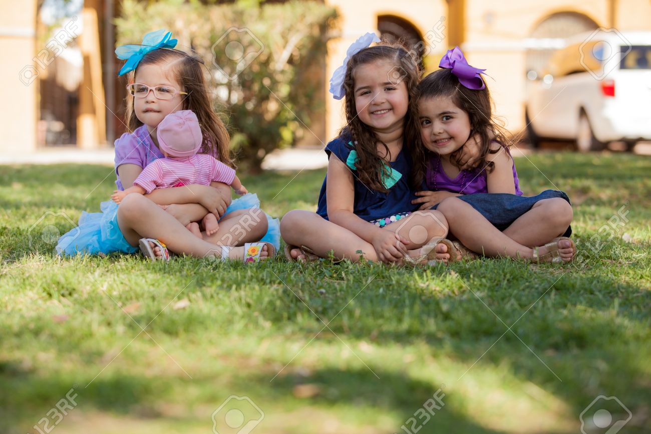little girls playing with dolls