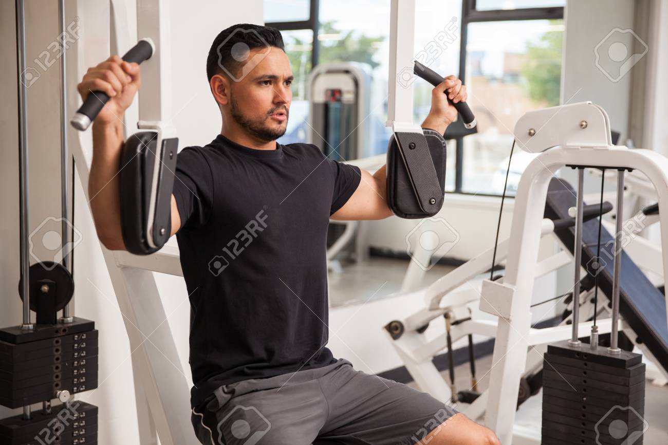 Good Looking Young Man Building Muscle At The Gym Using A Pec Deck Machine Stock Photo Picture And Royalty Free Image Image 53101557 Good Looking Young Man Building Muscle At The Gym Using A Pec Deck Machine Stock Photo Picture And Royalty Free Image Image 53101557