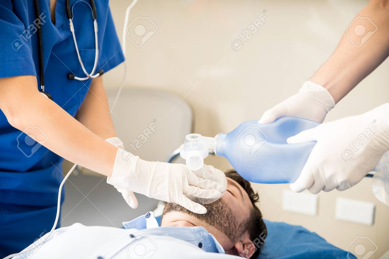 Close Up Of Doctors Hands Using An Ambu Bag For Resuscitating An Unconscious Patient In Emergency Room Stock Photo Picture And Royalty Free Image Image 100861408