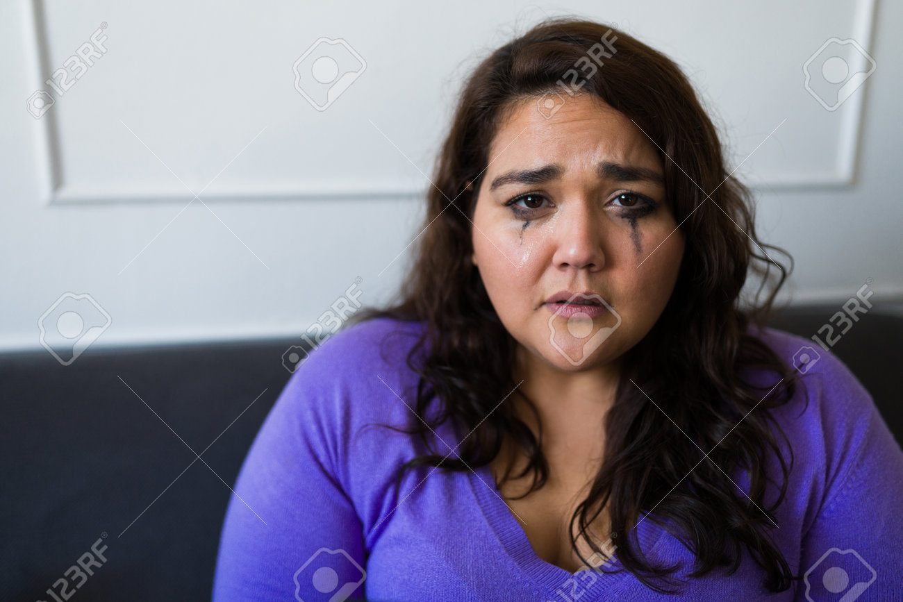 198439055-portrait-of-a-depressed-fat-woman-crying-ruining-her-mascara-and-makeup-looking-heartbroken-after-a.jpg