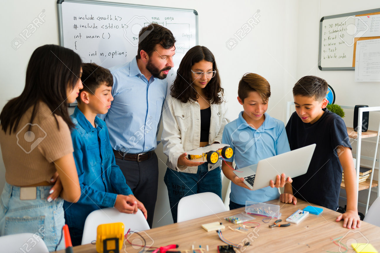 Students programming together