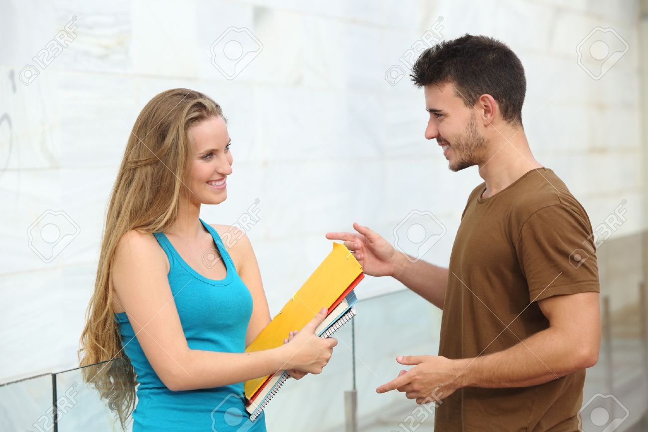 Two Students Boy And Girl Talking Happy Outside Of The Campus Stock Photo,  Picture And Royalty Free Image. Image 23050250.