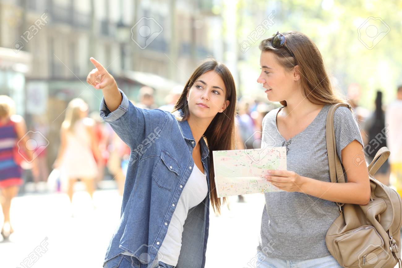 Lost tourist asking for help from a pedestrian in the street - 123603249 Lost tourist asking for help from a pedestrian in the street - 123603249