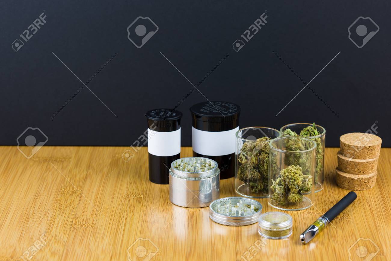 assorted medical marijuana in glass jars and containers with stock